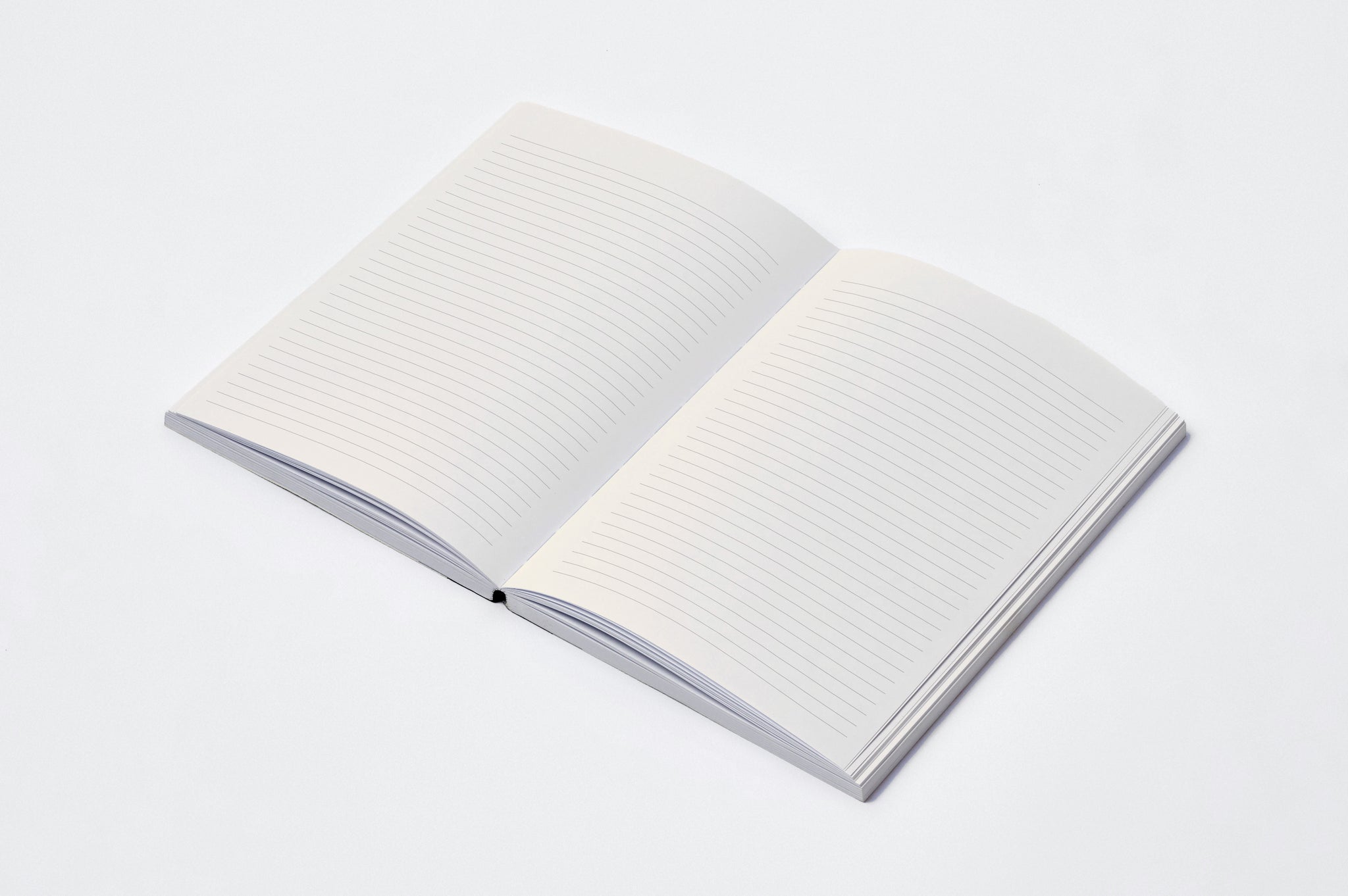 Open notebook with cream pages on a light gray background